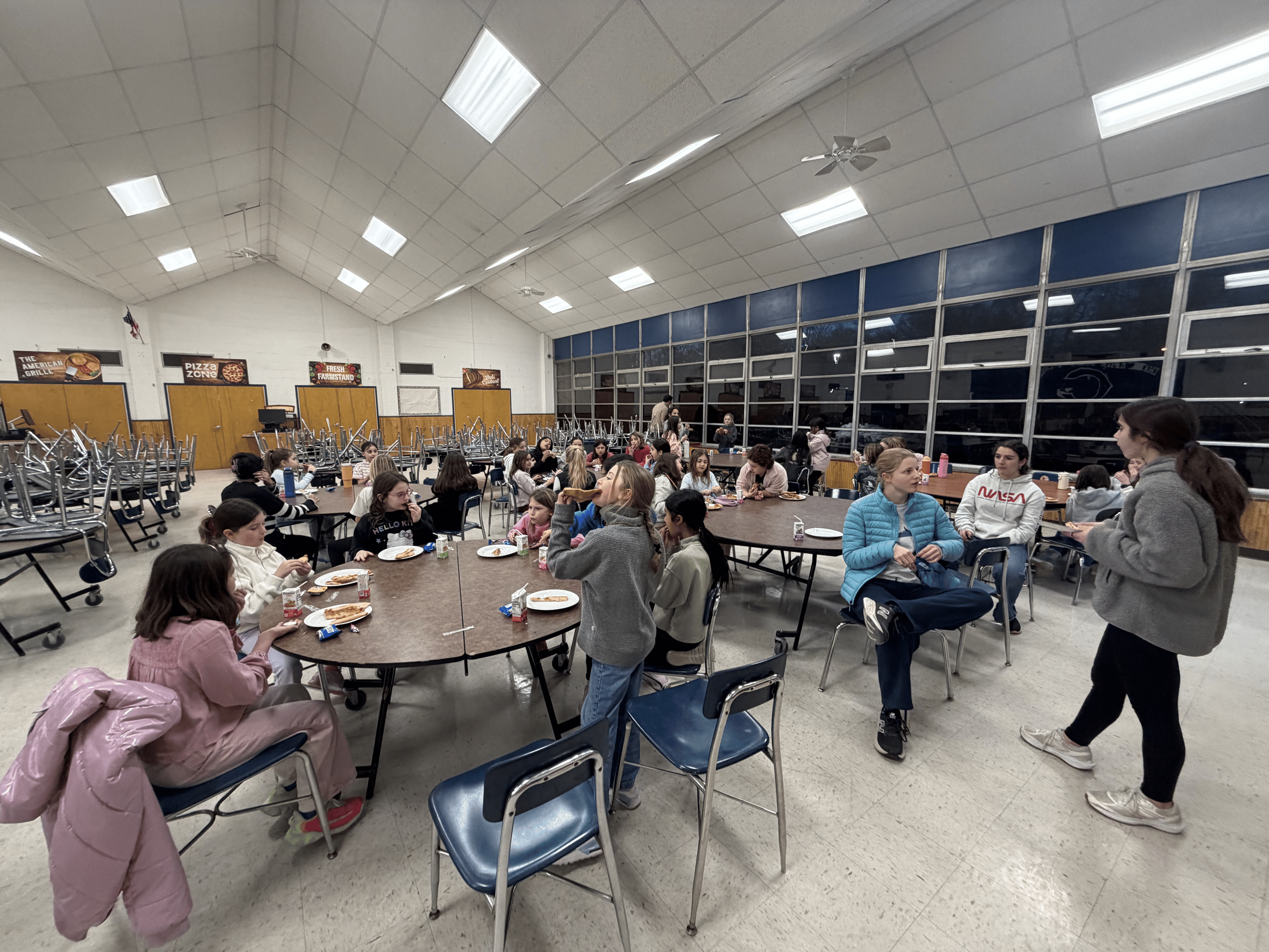 Girls sharing a meal together in the cafeteria