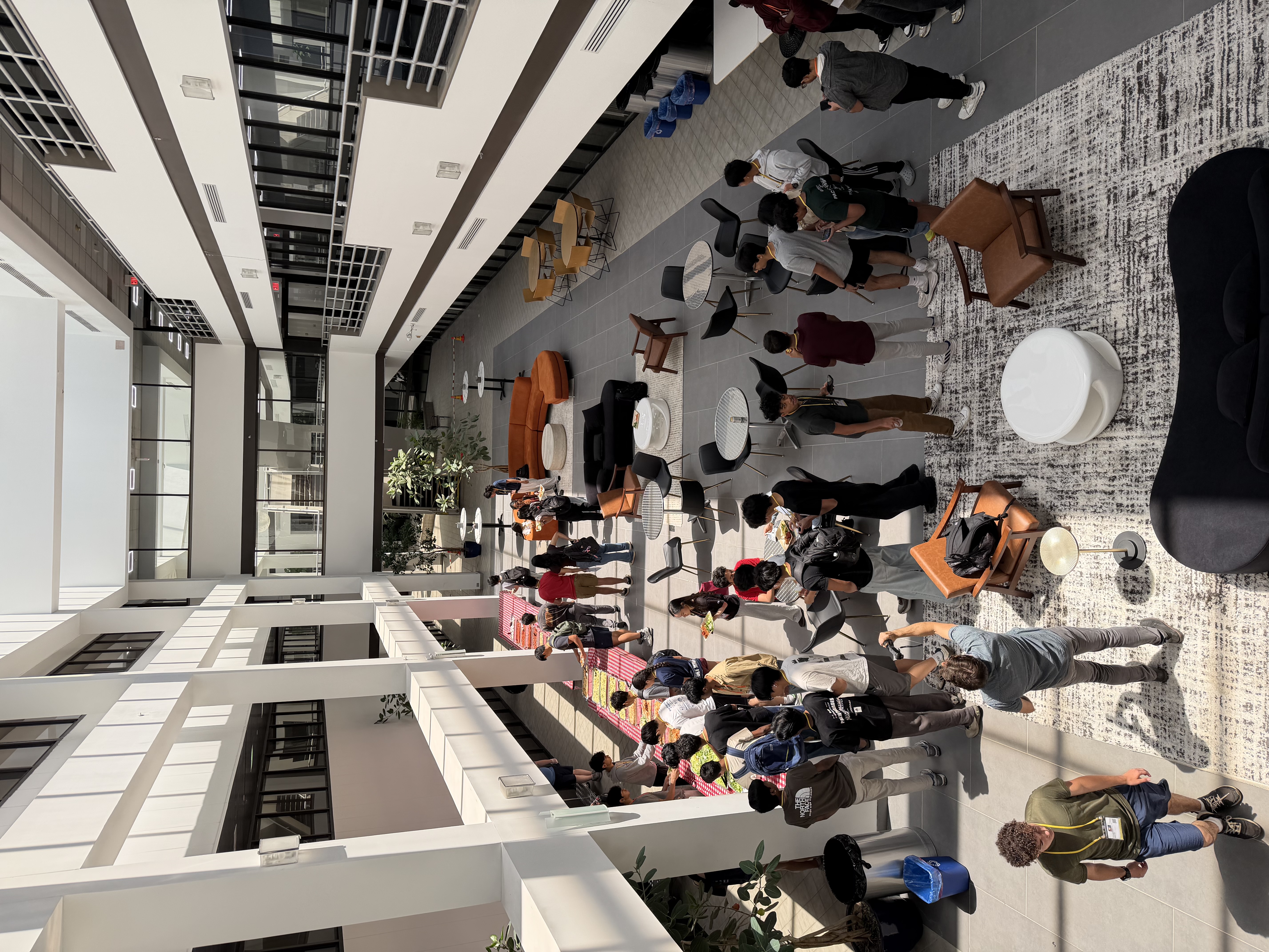 Overhead view of participants in the atrium